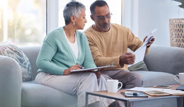 Two people comparing checklists